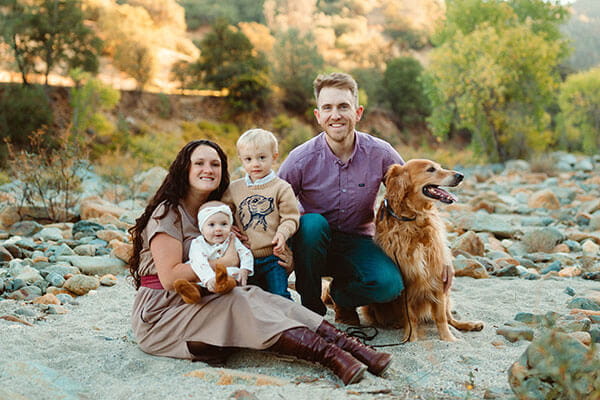 Matt and family posing for a picture outdoors